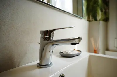 a bathroom sink with a silver faucet on a counter at Peaceful 2 Bedrooms with patio, near Metro A in Rome