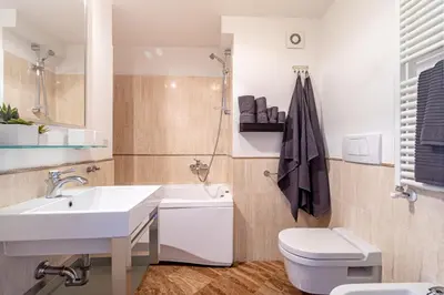 a white bathroom with a sink and a toilet at [Trastevere Lux* * * * *] - Roma Centro Storico in Rome