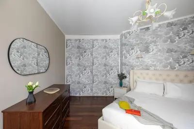 a bedroom with a bed and a mirror at iFlat Contemporary Elegance in the heart of Rome in Rome