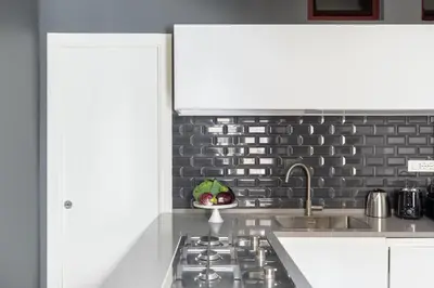 a kitchen with a sink and a counter top at iFlat Contemporary Elegance in the heart of Rome in Rome