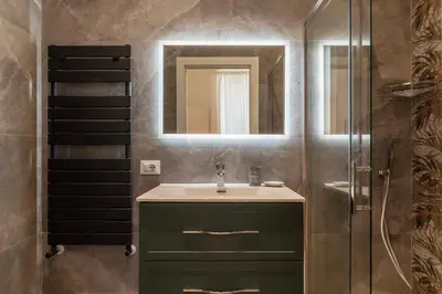 a bathroom with a sink and a shower at GuestHost - Rome Huge & Cozy Apartment in Rome