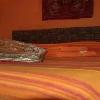 a bed with a pillow on top of it at Shiva B&B in Rome