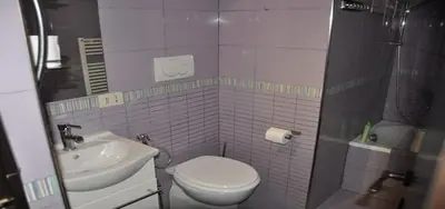 a small bathroom with a toilet and a sink at Shiva B&B in Rome