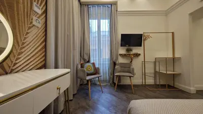 a hotel room with a bed and a tv at Antiqua Domus in Rome