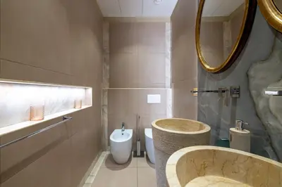 a bathroom with a tub and a toilet and a sink at Antiqua Domus in Rome