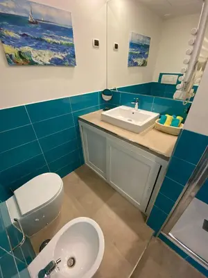 a bathroom with a white toilet and a sink at Apartment Villa Borghese with terrace in Rome