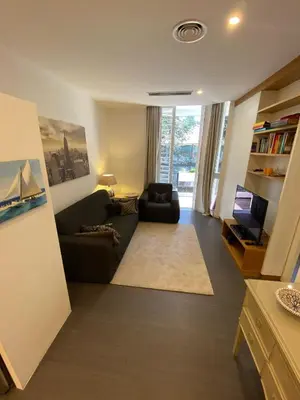 a living room with a couch and a television at Apartment Villa Borghese with terrace in Rome