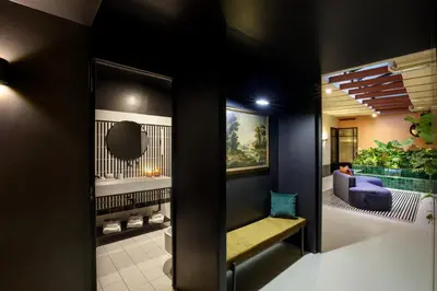 a living room with a couch and a mirror at Officina Daplace in Rome