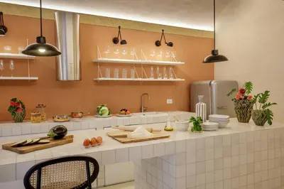 a kitchen with a counter with dishes on it at Officina Daplace in Rome