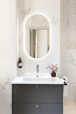 a bathroom with a sink and a mirror at Belli Boutique Guest House in Rome