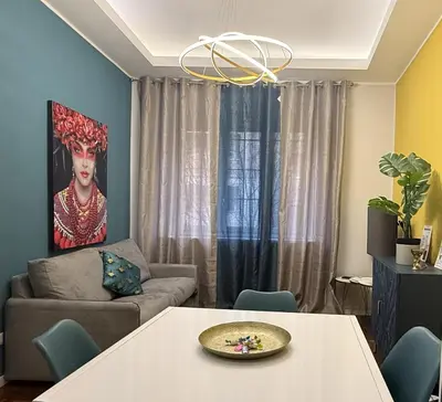 a living room with a couch and a table at La Casa di Rosa , Elegante Appartamento a Corso Trieste, Metro B in Rome