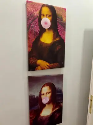 a pair of paintings of a nun with their mouths at La Casa di Rosa , Elegante Appartamento a Corso Trieste, Metro B in Rome