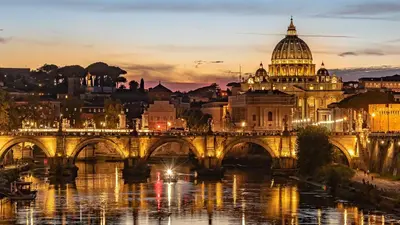 a view of a bridge over a river with a cathedral at La Casa di Rosa , Elegante Appartamento a Corso Trieste, Metro B in Rome