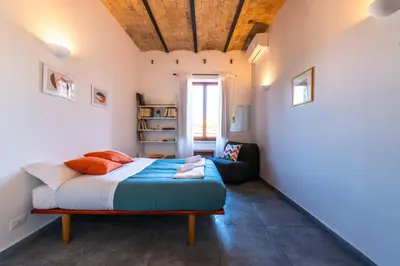 a bedroom with a bed with a wooden ceiling at Casa Bodoni in Rome