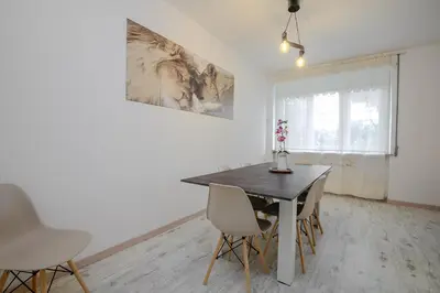 a dining room with a table and chairs at Ponte Milvio Apartment Flaminio in Rome