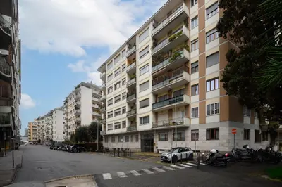 an apartment building with a car parked in front of it at Ponte Milvio Apartment Flaminio in Rome