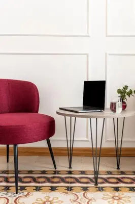 a red chair and a table with a laptop on it at SJR Luxury Apartment Trevi Fountain in Rome