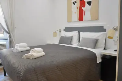 a bedroom with a bed with towels on it at Colosseo studios in Rome