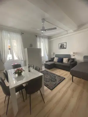 a living room with a table and a couch at Colosseo studios in Rome