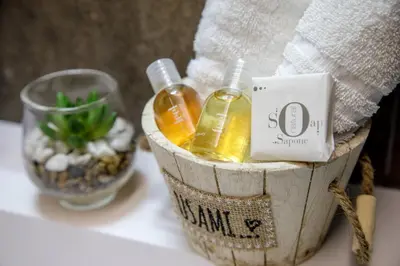 a basket with two bottles of alcohol on a table at Pio Vatican Flat in Rome
