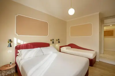 a bedroom with a large bed in a room at Suites 51 in Rome