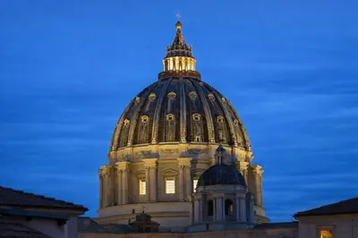 a dome of a building with a blue sky in the background at Central Rome 2BR Walk to Vatican & Piazza Navona in Rome