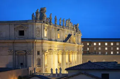 a building with statues on top of it at Central Rome 2BR Walk to Vatican & Piazza Navona in Rome