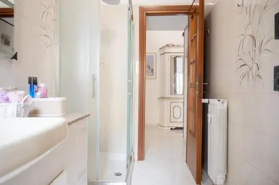 a bathroom with a shower and a sink and a mirror at Cerroni's Corner in Rome