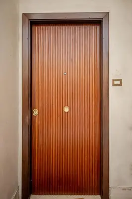 a large wooden door in a building at Cerroni's Corner in Rome