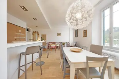 a kitchen and dining room with a table and chairs at San Pietro Al Vaticano by Halldis in Rome