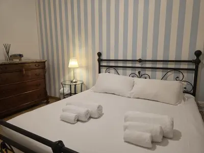 a bedroom with a bed with two towels on it at Be Your Home - MR House in Rome