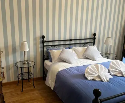 a bedroom with a bed with pillows on it at Be Your Home - MR House in Rome