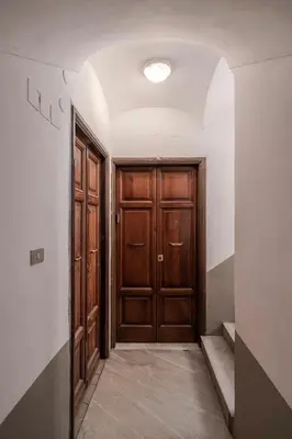 a hallway with a wooden door in a room at Star Beauty House in Rome