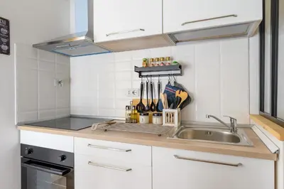 a kitchen with a sink and a counter top at Casa Camilla al Vaticano in Rome