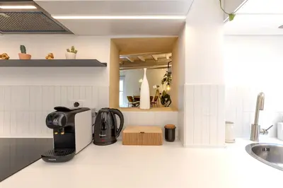 a kitchen with a coffee maker on a counter at Cantoni 4A - Loft at Colosseum in Rome