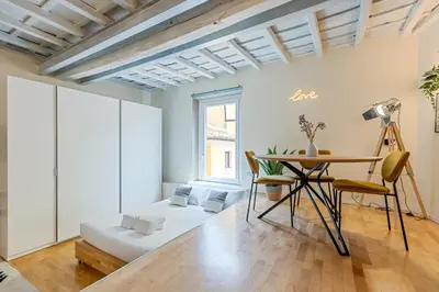 a living room with a table and a couch at Cantoni 4A - Loft at Colosseum in Rome