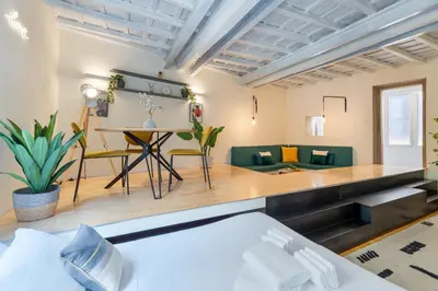 a room with a bed and a living room at Cantoni 4A - Loft at Colosseum in Rome