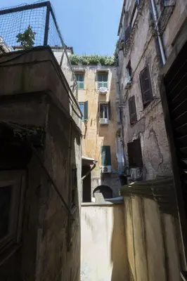 an alley in an old city with a building at Campo de Fiori Large Family Apartment in Rome