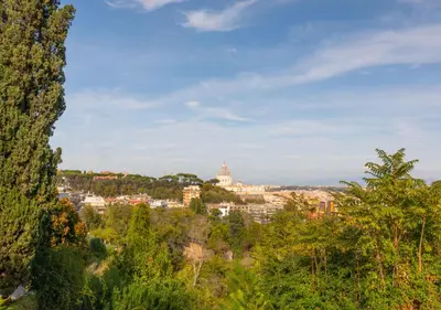 a view of a city from a hill with trees at Vatican family loft in Rome