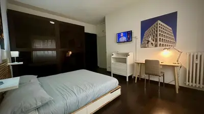 a bedroom with a bed and a desk and a desk at Aniene GH in Rome
