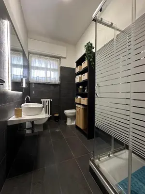 a bathroom with a tub and a sink and a toilet at Aniene GH in Rome