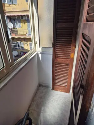 an empty room with a window and a staircase at Appartamento-Castro Pretorio in Rome