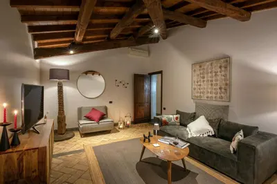 a living room with a couch and a table at Maison Medusa in Rome