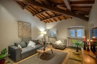 a living room with a couch and a table at Maison Medusa in Rome