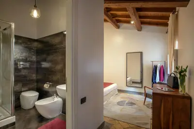a bathroom with a toilet and a sink and a tub at Maison Medusa in Rome