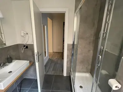a bathroom with a shower and a sink at This must be the place Rome Guesthouse in Rome