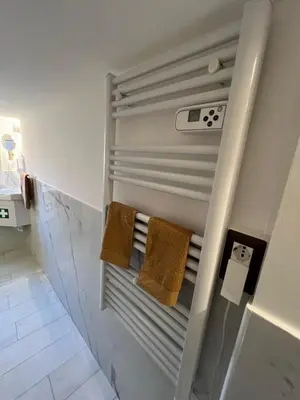 a walk in shower with two towels in a bathroom at Loft a piazza di Spagna in Rome