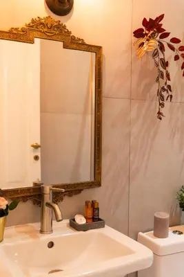 a bathroom with a sink and a mirror at Piacentino Homes San Giovanni apartment in Rome