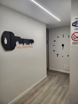 a room with a guitar on the wall at Piol Guest House in Rome