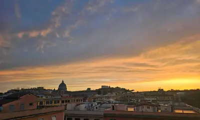 a view of a city skyline at sunset at Vatican Prestige - Meospiti Cesare Exclusive in Rome